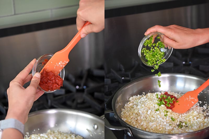 Adding tomato paste and diced chilis to the riced cauliflower to make healthy Mexican Cauliflower Rice