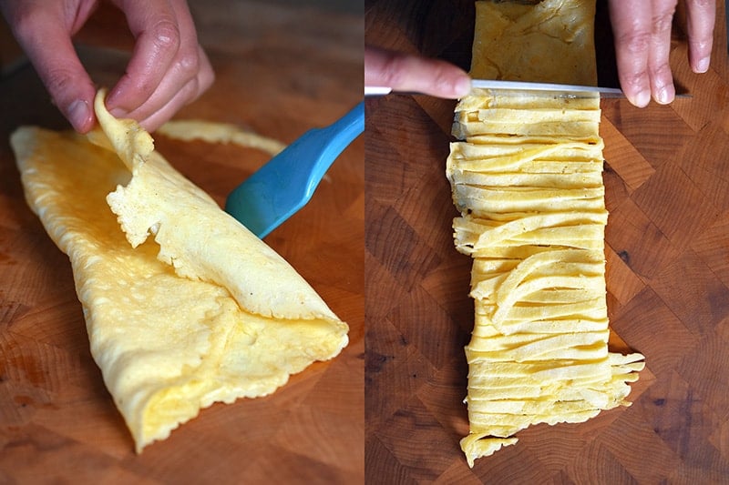 Folding the thinly cooked egg omelet and slicing it into thin pieces.