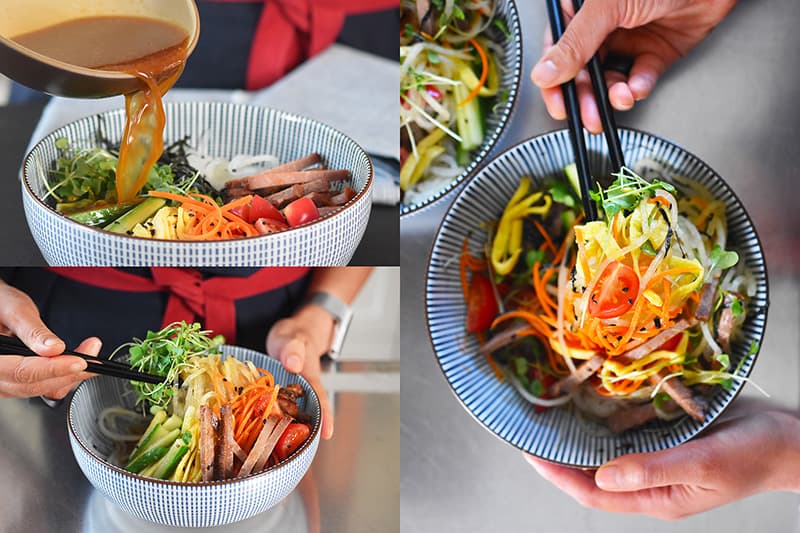 Someone adding the all-purpose stir-fry sauce to the Paleo Hiyashi Chūka bowl and mixing the ingredients.