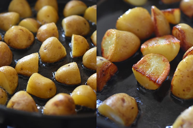 Frying the cooked potatoes in a cast iron skillet until crispy.