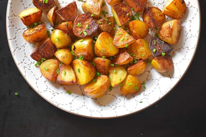 An overhead shot of Instant Pot Crispy Potatoes on a white platter