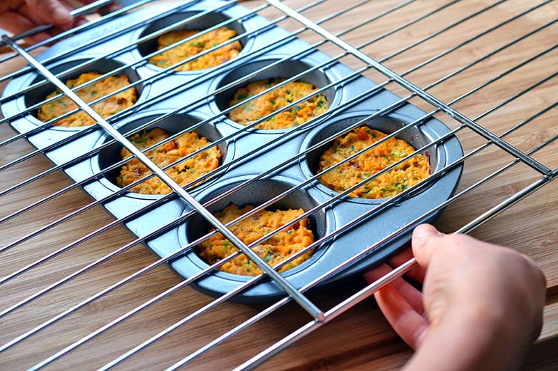Someone getting ready to transfer the spicy tuna cakes onto a wire rack to cool.