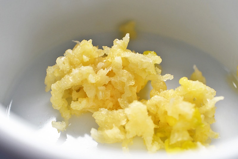 Minced garlic in a small bowl.