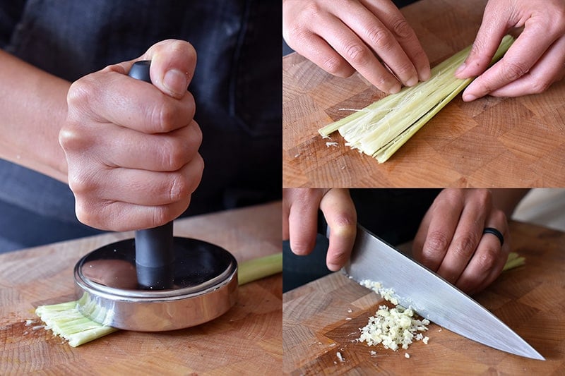 Smashing a piece of lemongrass with a meat pounder before mincing with a kitchen knife.