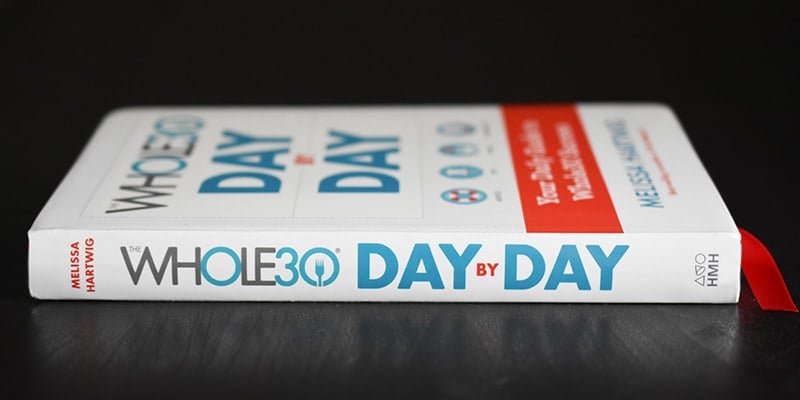 A side view of the Whole30 Day By Day journal.
