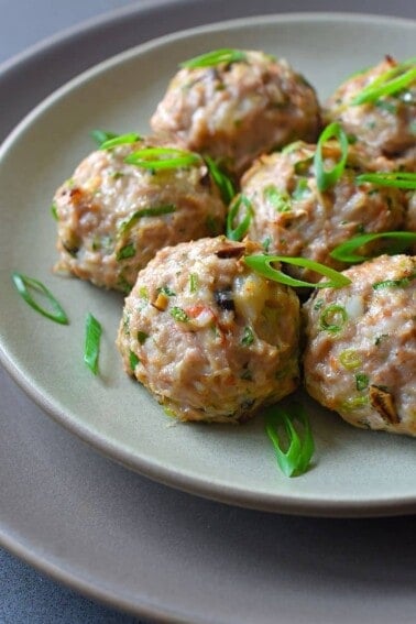 A plate filled with wonton meatballs.