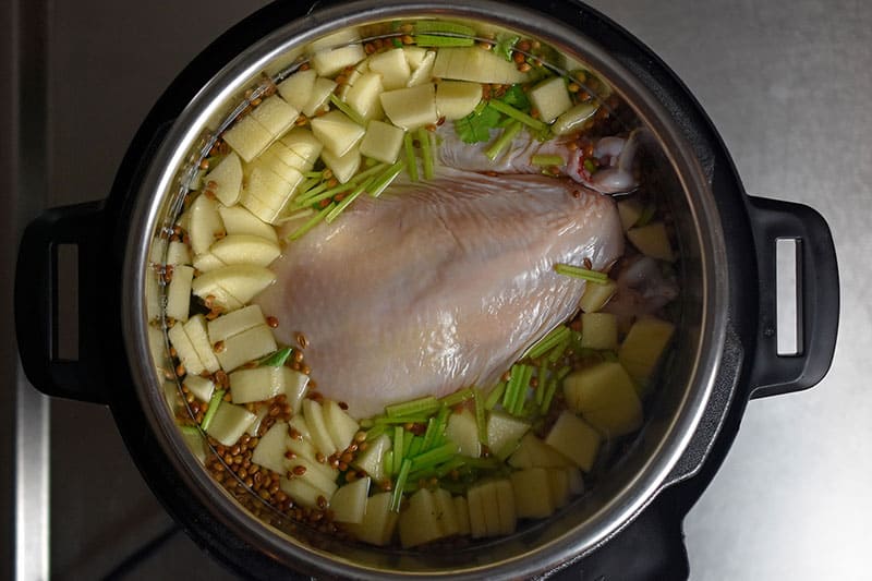 An overhead shot Instant Pot (Pressure Cooker) Chicken Pho before everything is cooked.