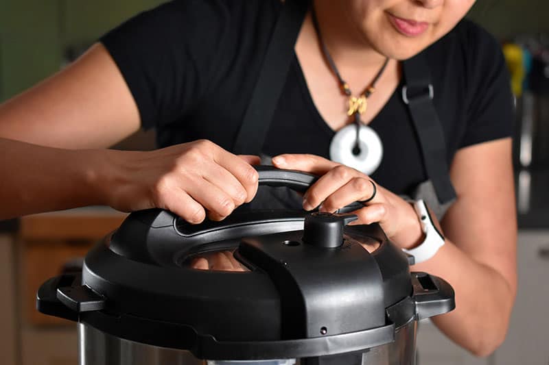 Locking the lid on the Instant Pot to make Instant Pot (Pressure Cooker) Chicken Pho 