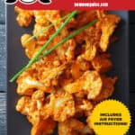 An overhead shot of baked buffalo cauliflower on a gray rectangular plate with 3 chives on top. The red banner at the bottom says paleo, Whole30, and gluten-free. There is a gold star that says includes Air Fryer Instructions.