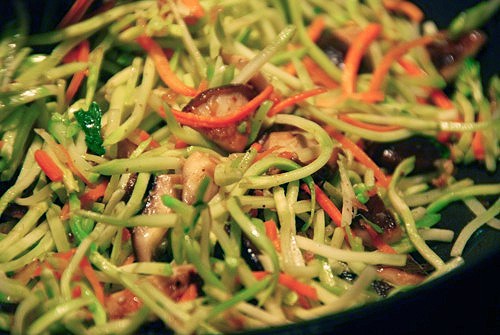Paleo and Whole30 stir-fried shiitake and broccoli slaw in a pan.