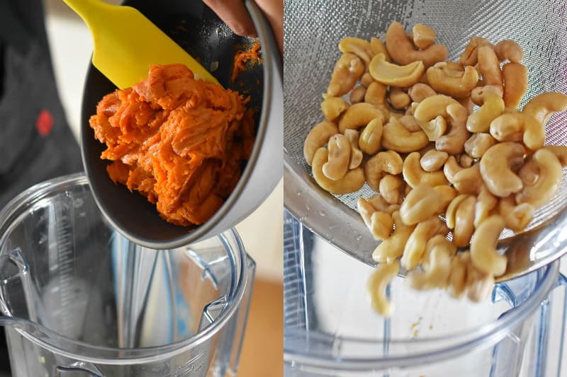 Someone adding cooked sweet potatoes and soaked cashews into a blender.