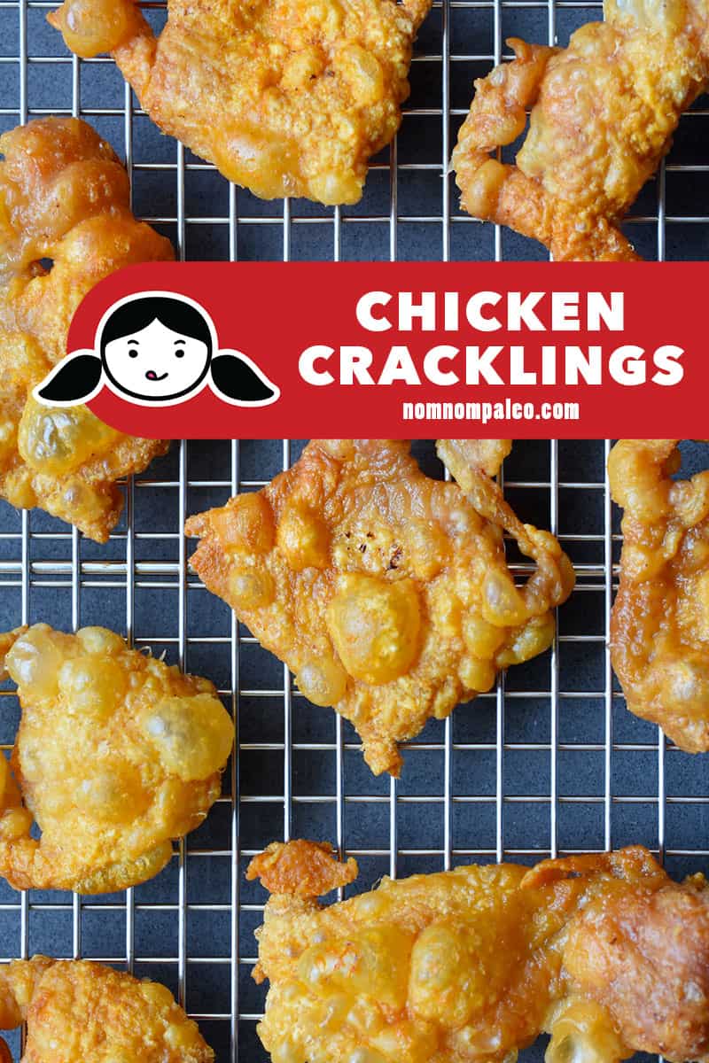 An overhead shot of a tray of crispy chicken skins cooling on a wire rack.