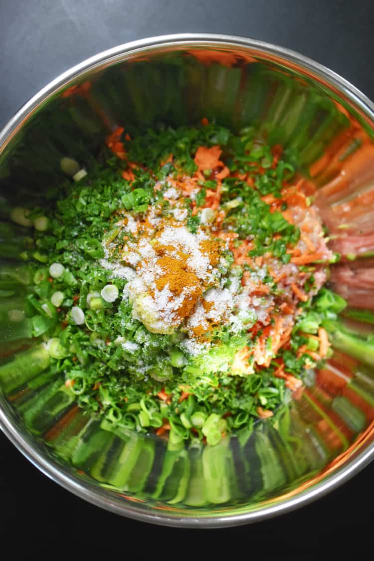 An overhead shot of the raw ingredients of Curry Turkey Bites in a mixing bowl.