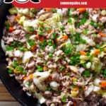 An overhead shot of Nom Nom Paleo's Egg Roll in A Bowl in a cast iron skillet. The red banner at the bottom says paleo, Whole30, Keto.