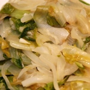 Paleo and Whole30 braised escarole with onions on a plate.