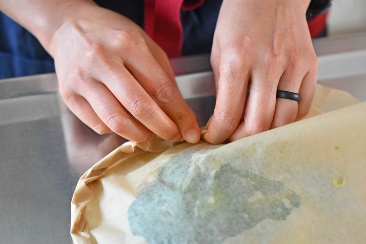 Crimping the sides of Fiona’s Phenomenal Fish Packets to close them up.