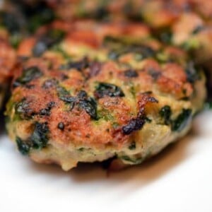 Close up of green pork and shiitake sliders or patties.