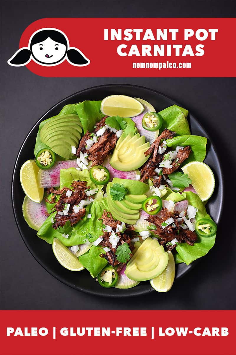 An overhead shot of a platter filled with Nom Nom Paleo Instant Pot Carnitas, lettuce leaves, diced onion, jalapeños, sliced avocados, and lime wedges. There is a red banner at the bottom that says paleo, gluten-free, and low carb