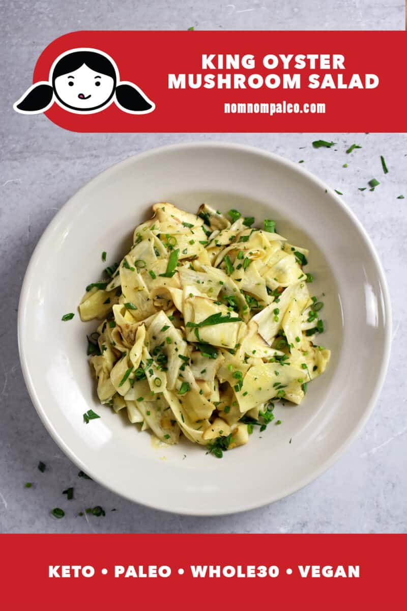 An overhead shot of a bowl with shaved king oyster mushroom salad with fresh herbs on top. The red banner at the bottom says paleo, whole30, vegan, and keto