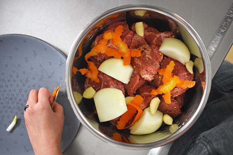 An overhead shot of Instant Pot (Pressure Cooker) Carnitas with the raw ingredients.