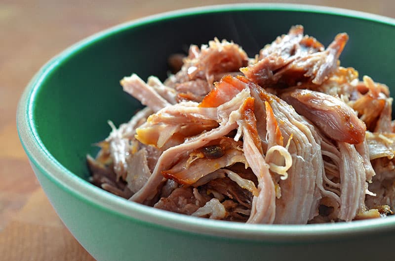 A shot of a bowl of Instant Pot Kalua Pig by Nom Nom Paleo
