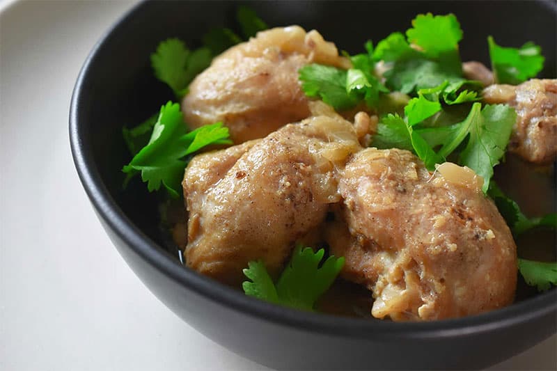 A closeup shot of a bowl of Instant Pot Lemongrass Coconut Chicken