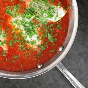 An overhead shot of Poached Cod in Tomato Sauce.