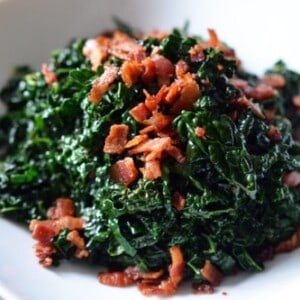 A bowl of paleo stir fried kale and bacon.