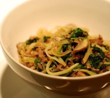 A bowl of the paleo approved stir fried kelp noodles with ground beef, broccoli slaw, and spinach recipe.