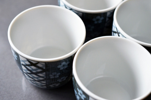 8 ounce cups sitting on a counter.