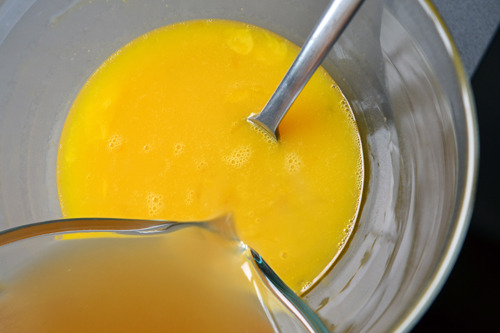 Combining the whisked eggs and bone broth for paleo chawanmushi.