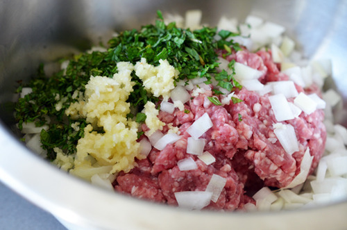 Assembled ingredients for lamb dosas in a metal bowl.