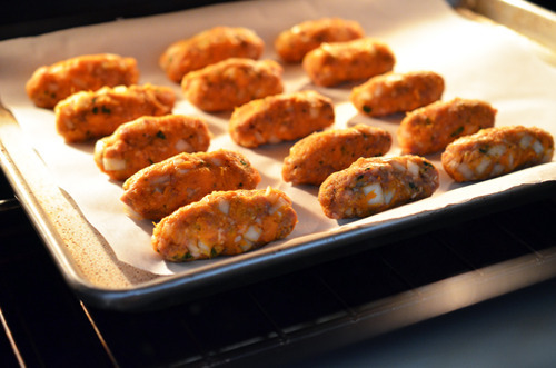 Baking the filling for lamb dosas on a tray.