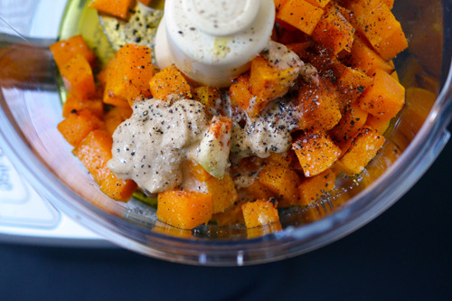 The ingredients for butternut squash dip in a food processor.