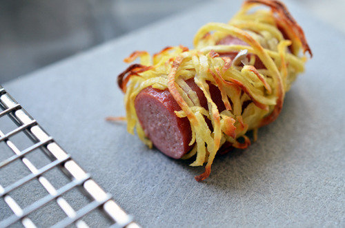 Cutting the bottom of a healthy paleo Yummy Mummy so it can stand up on a plate.
