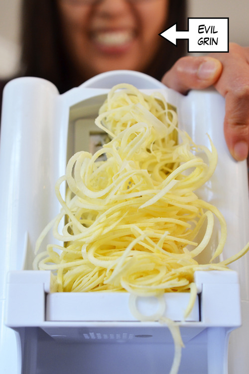 Spiralizing white sweet potatoes to make paleo Yummy Mummies, a healthy kid snack for Halloween