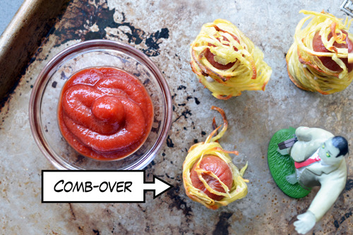 An overhead shot of a tray of paleo Halloween Yummy Mummies next to a bowl of paleo ketchup.
