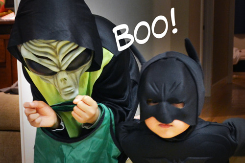 Two kids in Halloween costumes.