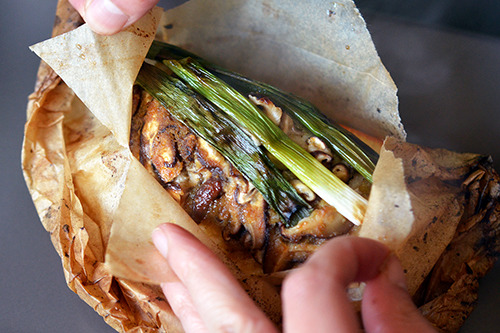 An open Fish en Papillote packet with Citrus, Ginger, & Shiitake 