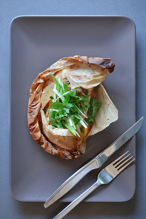 Overhead shot of Fish en Papillote (in Parchment) with Citrus, Ginger, & Shiitake 