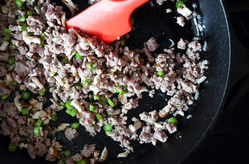 An overhead shot of the cast iron skillet with the filling for savory egg custard.
