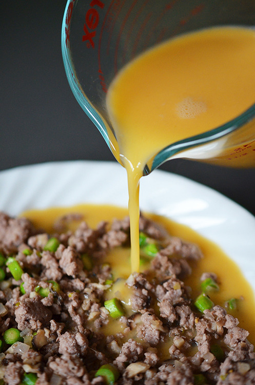 The egg mixture is poured into the plate with the custard filling.