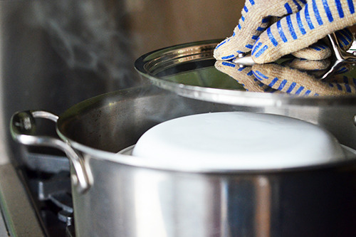 The lid is placed on the pot containing the Cantonese Egg Custard with Minced Pork 