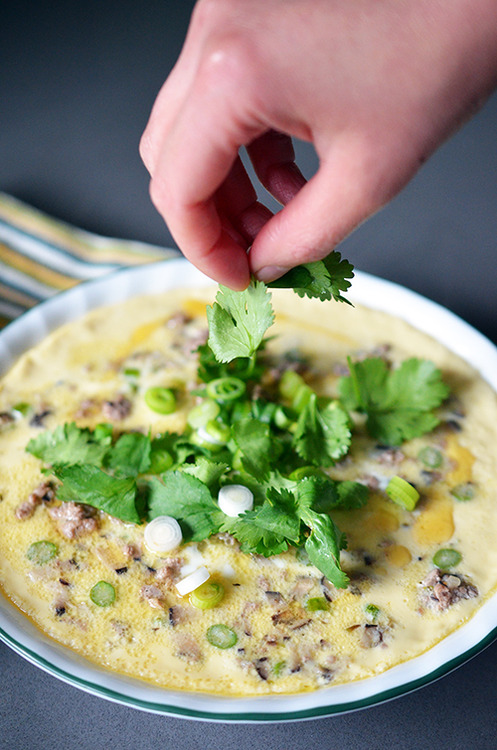 Fresh herbs are placed on top of the Cantonese Egg Custard with Minced Pork 