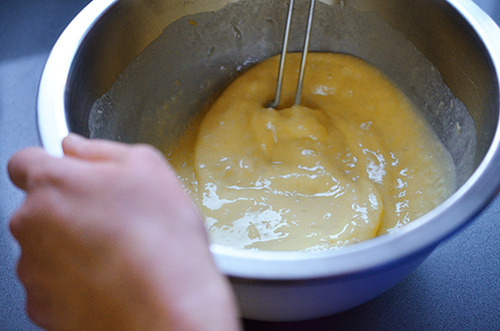 A whisk mixes the paleo pancake batter.