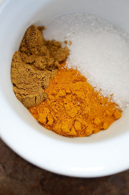 An overhead shot of the spices used to season paleo Atkilt Ethiopian Vegetable Stew in a small bowl.