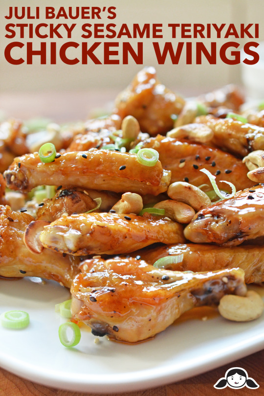 Sticky sesame teriyaki chicken wings piled on a plate.