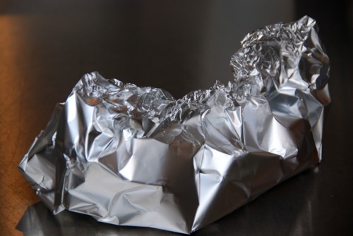 An aluminum pack of chestnuts with water.