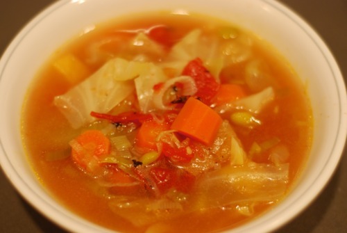 A bowl of garlic soup that is Whole30 and paleo friendly.