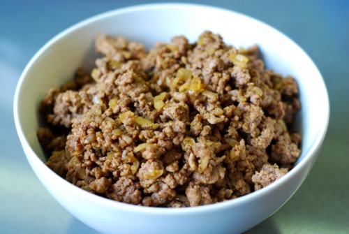 A bowl of cooked brown beef for a mini frittata recipe.